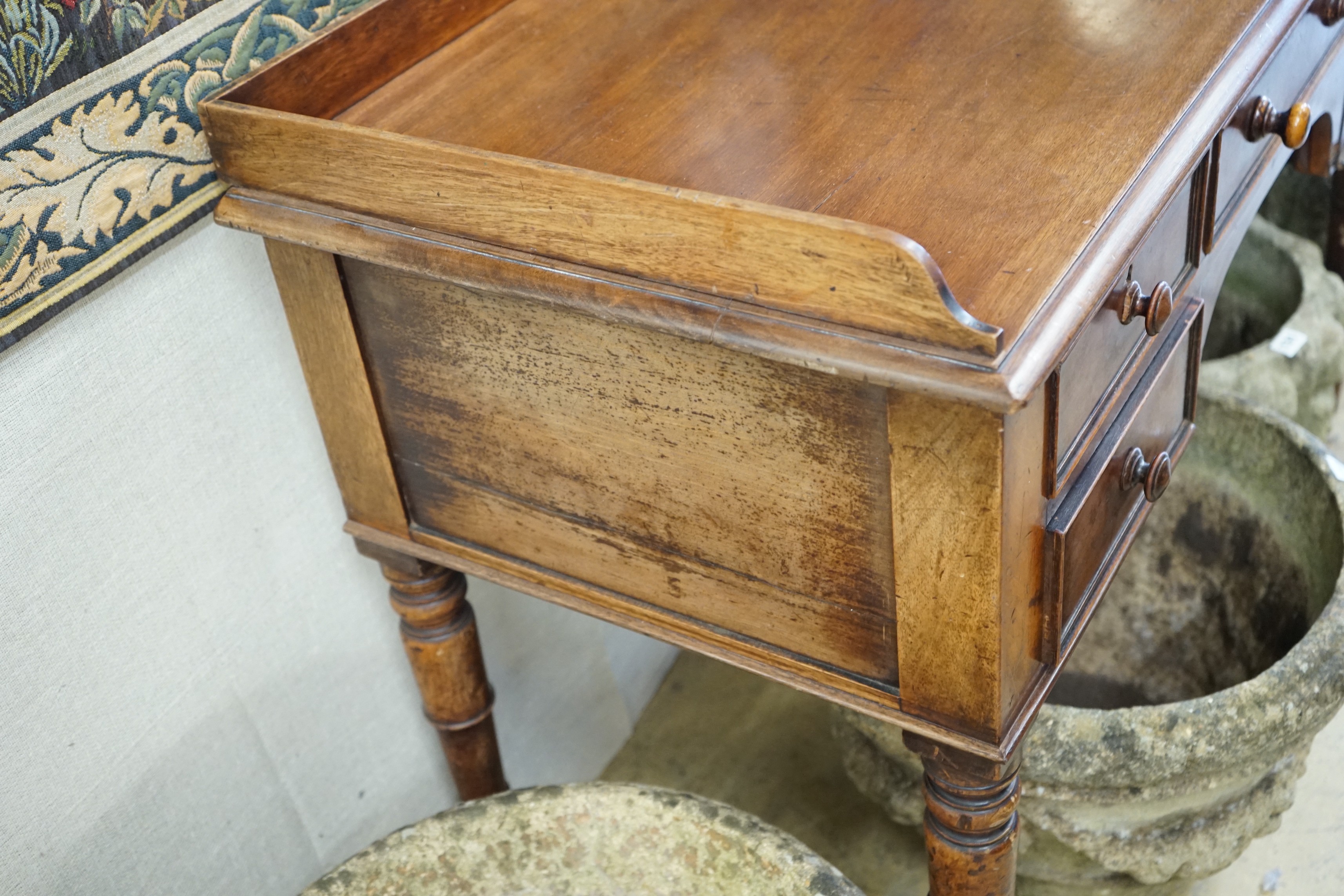 A Victorian mahogany kneehole dressing table, width 112cm, depth 52cm, height 79cm